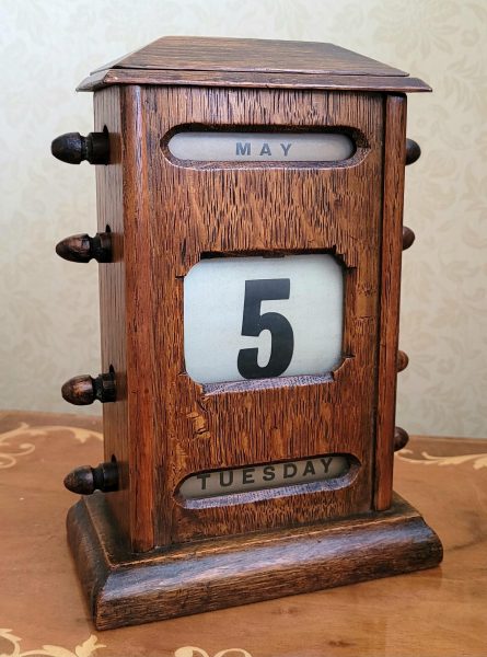 Beautiful wooden antique or vintage perpetual calendar